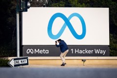 A man takes a photo at Meta (formerly Facebook) corporate headquarters in Menlo Park, California, on Nov. 9, 2022. (Josh Edelson/AFP/Getty Images/TNS)