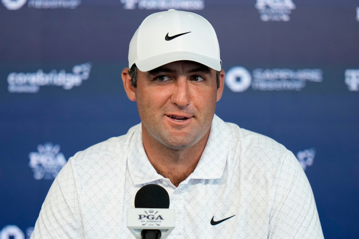 Scottie Scheffler speaks with the media after a PGA Championship golf tournament practice round at Aronimink Golf Club, Tuesday, May 12, 2026, in Newtown Square, PA. (AP Photo/Frank Franklin II)