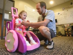 Staff photo by Matt Hamilton / Kenton Aiken plays with his daughter, Amelia, 2, in the UTC College of Engineering and Computer Science Building on Aug. 7, 2026.