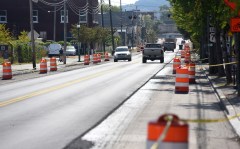 Staff photo by Matt Hamilton / Work continues on Main Street in Chattanooga on Sept. 11, 2026. A $2.6 million project to convert Main Street from four lanes to two or three wider lanes started Aug. 30 and is on track for completion by Halloween, according to the state Department of Transportation.
