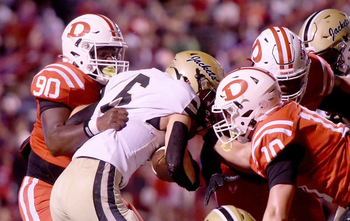 Staff Photo by Matt Hamilton / Dalton's Malachi Long (90) and Bo Green (10) close in on visiting Calhoun's Logan Speer (6) during Friday night's GHSA matchup of nonregion rivals at Harmon Field.
