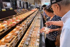 AP File Photo/Nam Y. Huh / Customer shop warily amid higher prices at a grocery store in Arlington Heights, Ill., in July.