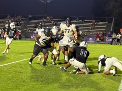 Staff Photo by Stephen Hargis / Marion County defensive lineman Kye'Von McDonald (11) stops Chattanooga Prep running back Cedric Baulding for a loss in the backfield during a TSSAA nonregion matchup Friday night in Jasper, Tenn.