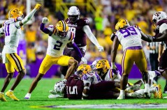 LSU Athletics photo / LSU defenders celebrate during last Saturday night's 35-6 rout of Texas A&M. The Aggies are 2-2 this season after winning their first 11 games last year.