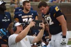 Staff Photo by Matt Hamilton / UTC junior Jacob Ziegler (62) and other offensive linemen watch a video replay with position coach Kevin Revis on the home sideline at Finley Stadium during the Mocs' Sept. 5 game against Tennessee Tech. Ziegler is a first-year transfer from Morehead State who was working at guard before moving into the starting lineup at tackle.