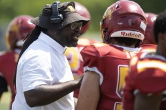 Staff Photo by Seth Carpenter / Howard football coach Dedric Maffett speaks with Kivi Paiz (56) during an Aug. 29 home game against Brainerd at Reggie White Field.