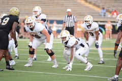UTC photo by Laura O'Dell / UTC tight end T.J. Briggs puts his hand down as he lines up for a play during the team's 41-7 home win against Wofford on Sept. 19, when the Mocs rushed for more than 300 yards.