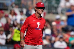 Philadelphia Phillies interim manager Don Mattingly walks to the mound during a playoff game against the host Atlanta Braves on Sept. 30. (AP Photo/Brynn Anderson)