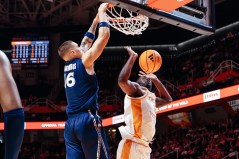Xavier Athletics photo / Xavier's Nikos Chitikoudis dunks over Tennessee's DeWayne Brown II during Thursday night's 86-70 exhibition win by the Musketeers in Knoxville.
