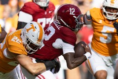 Alabama quarterback Keelon Russell (12) is sacked by Tennessee linebacker Jeremiah Telander (22) during Saturday's game in Neyland Stadium. (AP Photo/Wade Payne)