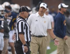 Staff File Photo by Matt Hamilton/ UTC coach Rusty Wright talks with the referee during the Mocs' loss to Western Carolina at Finley Stadium on Saturday, Nov. 1, 2025, one of four consecutive losses to the Catamounts.
