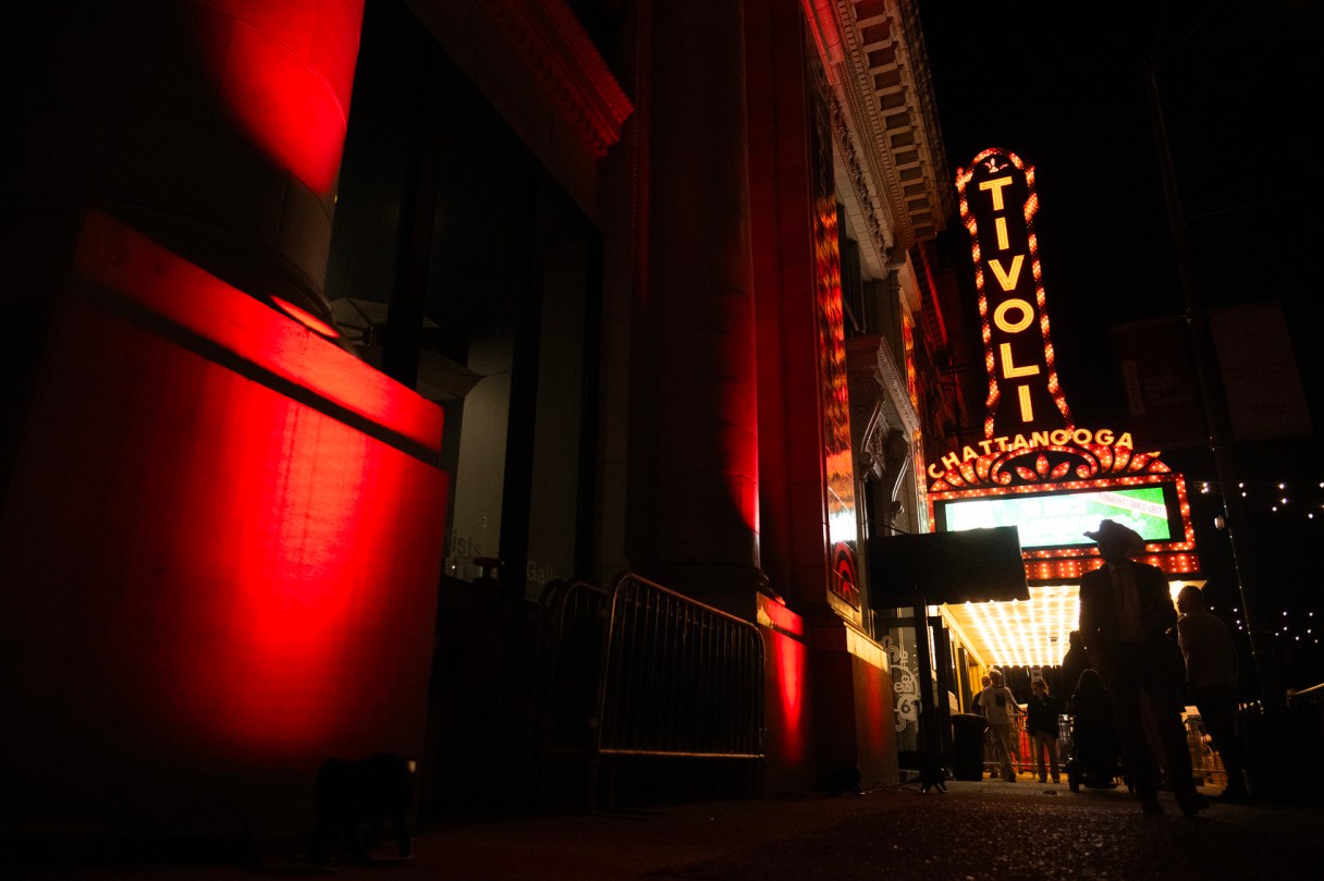 Staff Photo by Seth Carpenter / The Tivoli Theatre is seen as an adjacent building glows red during the theatre's grand reopening Oct. 20, 2026. The more than century-old theatre closed its doors in May 2022 to undergo extensive renovations.