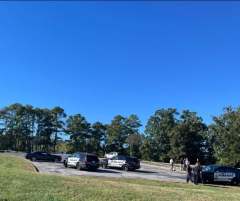 Chattanooga Police Department / Several Chattanooga police vehicles are parked near Chickamauga Dam day use area on Friday, Oct. 23, 2026, after officers responded to a 911 call that resulted in a man being shot.
