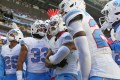 Tennessee Titans safety Amani Hooker, center, celebrates with teammates after intercepting a pass during an AFC South Division victory against the Indianapolis Colts last Sunday at Lucas Oil Stadium. (AP Photo/Jeff Roberson)