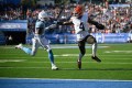 Cleveland Browns quarterback Deshaun Watson (4) holds off Tennessee Titans safety Kevin Winston Jr. (23) on his way to scoring a touchdown during the second half of Sunday's game at Nashville's Nissan Stadium. (AP Photo/John Amis)